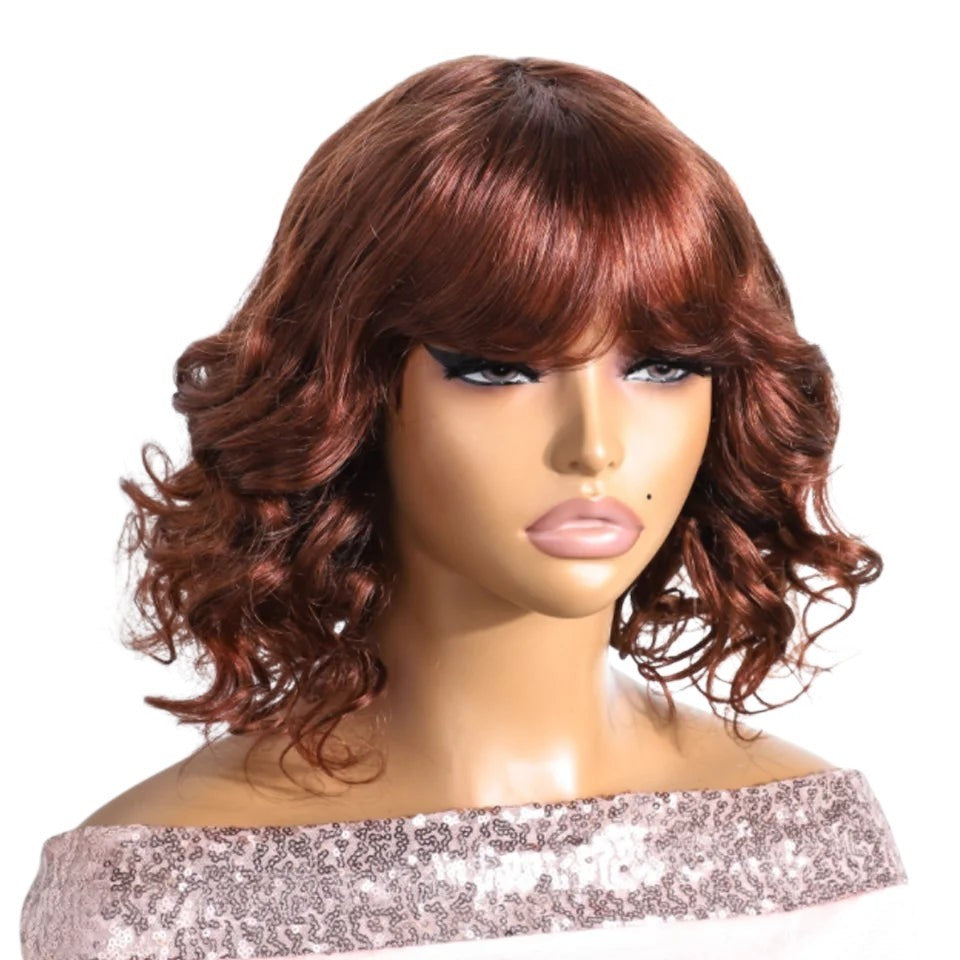 RitzWigs short auburn body wave bob human hair wig with bangs on a mannequin