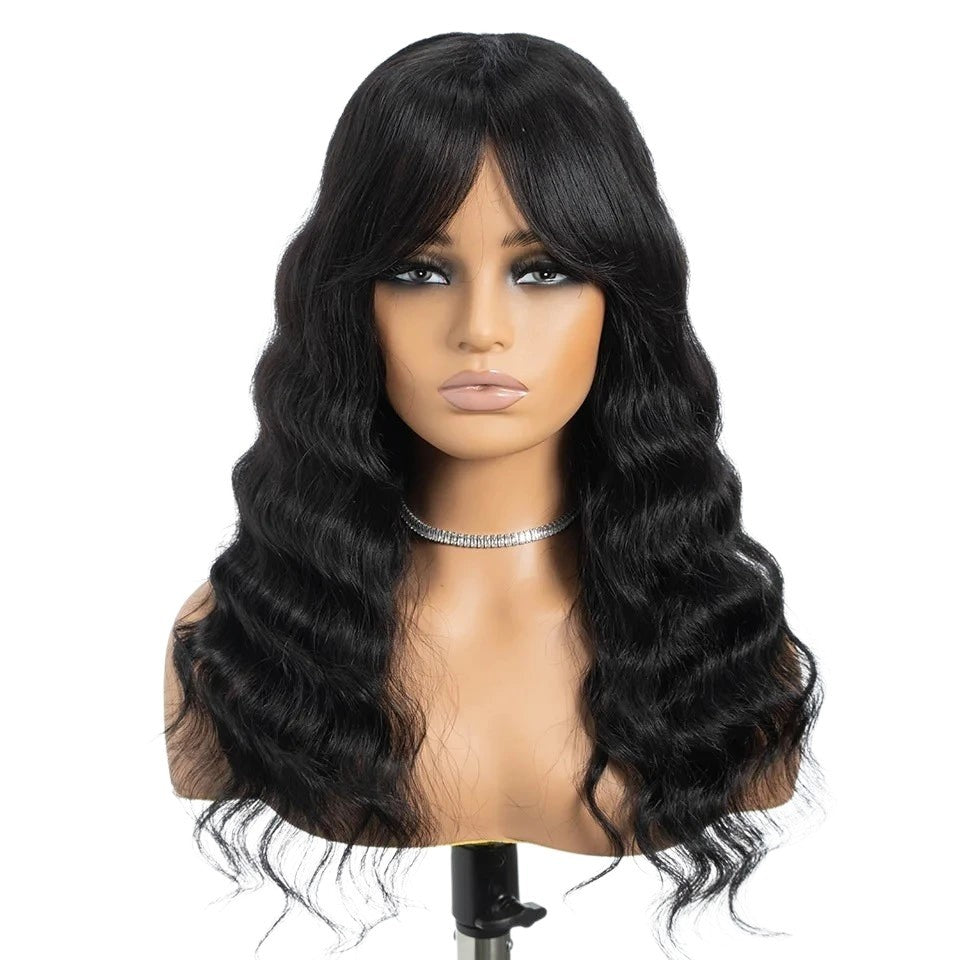 RitzWigs deep wave human hair wig with bangs in natural black, featuring 180% density and a wavy texture.