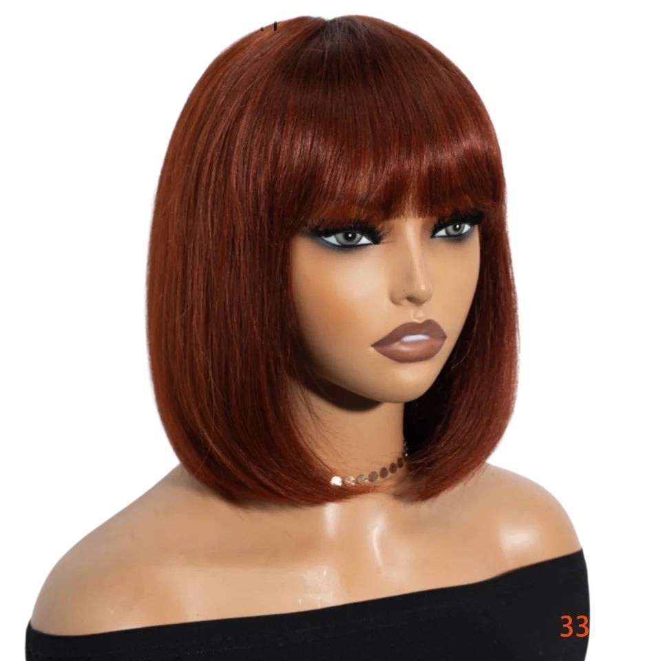 RitzWigs short straight brown bob wig with bangs on a mannequin head, featuring Brazilian human hair and Swiss lace.