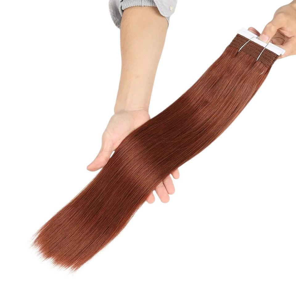 RitzWigs human hair tape-in extensions in a silky straight auburn brown texture held in hand