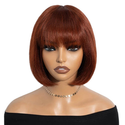 RitzWigs short auburn straight bob human hair wig with bangs on a mannequin head