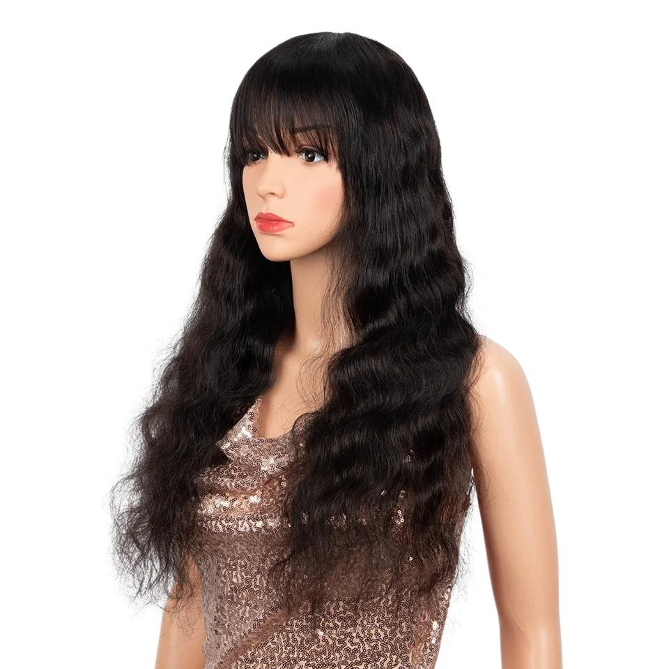 RitzWigs natural black body wave human hair wig with bangs on a mannequin, featuring long wavy Peruvian Remy hair.