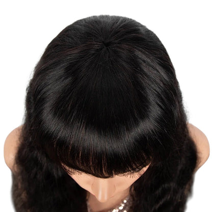 RitzWigs natural black body wave human hair wig with bangs on a mannequin head, top view