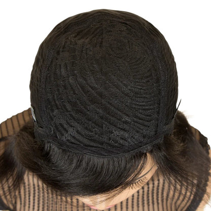 RitzWigs black human hair wig cap construction showing the interior machine-made lace lining on a mannequin head