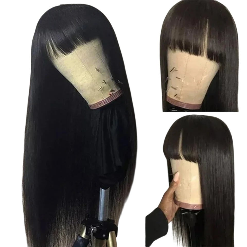 RitzWigs natural black straight human hair wig with bangs on a mannequin head, showing a sleek, glueless design.