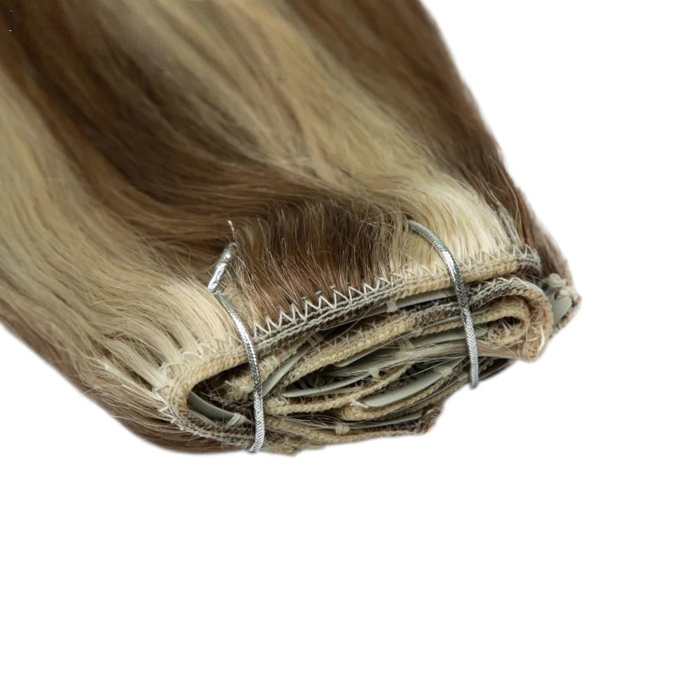 RitzWigs 7-piece straight human hair clip-in extensions in blonde and brown highlights with double weft construction
