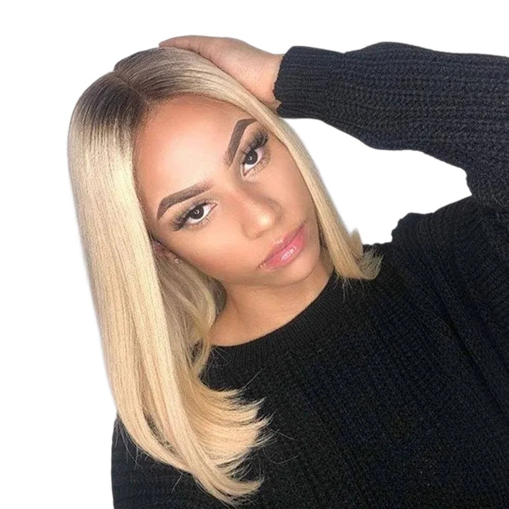 RitzWigs blonde ombre straight bob human hair lace front wig worn by a woman with a middle part