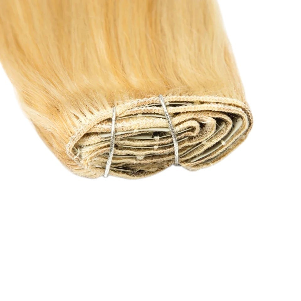 RitzWigs blonde straight human hair clip-in extensions set featuring secure metal clips on a weft.