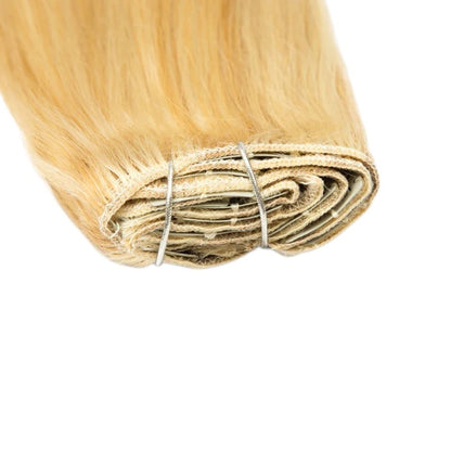 RitzWigs blonde straight human hair clip-in extensions set featuring secure metal clips on a weft.