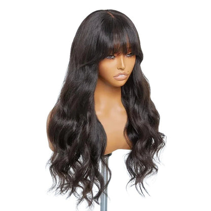RitzWigs 24-inch body wave human hair wig with bangs on a mannequin head, featuring natural dark wavy Remy hair.