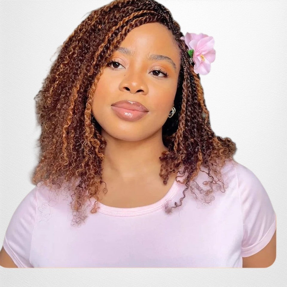 RitzWigs Brazilian afro kinky curly human hair extensions styled in twists on a woman with a pink flower accessory