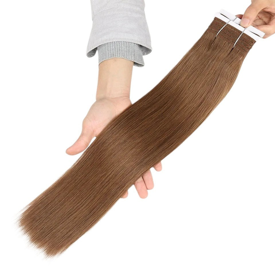 RitzWigs silky straight human hair tape-in extensions in a medium brown shade held in hands