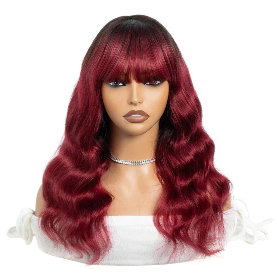 RitzWigs burgundy 99J body wave human hair wig with bangs on a mannequin head