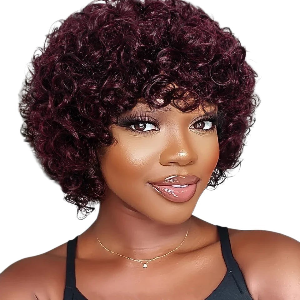 RitzWigs short burgundy afro kinky curly human hair bob wig with bangs worn by a woman
