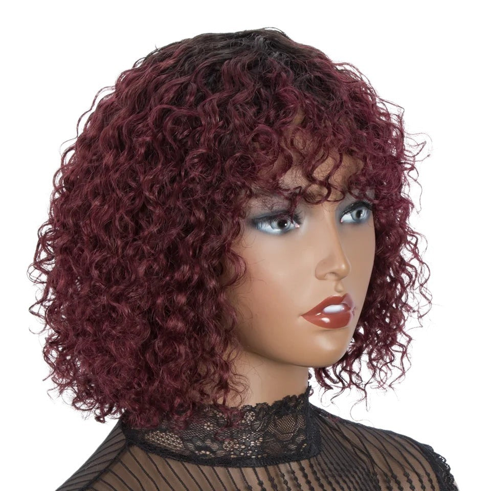 RitzWigs short burgundy kinky curly human hair wig with bangs on a mannequin head