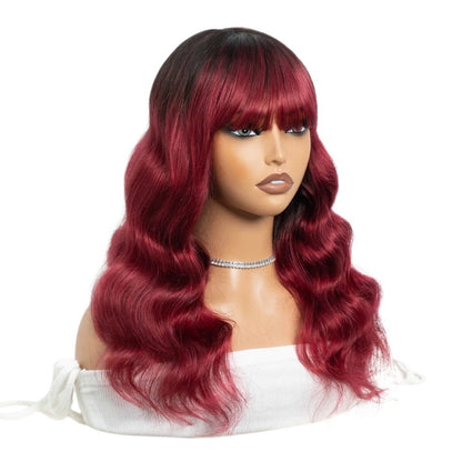RitzWigs burgundy ombre body wave human hair wig with bangs on a mannequin head