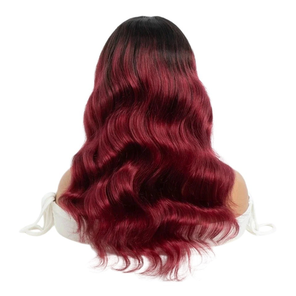 RitzWigs burgundy and black ombre body wave human hair wig on a mannequin head, showing long wavy texture.