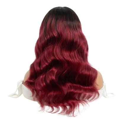 RitzWigs burgundy and black ombre body wave human hair wig on a mannequin head, showing long wavy texture.