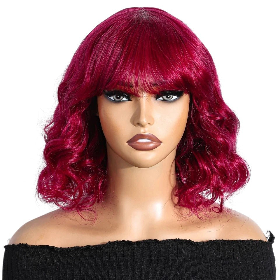 RitzWigs short burgundy red body wave bob wig with bangs on a mannequin head