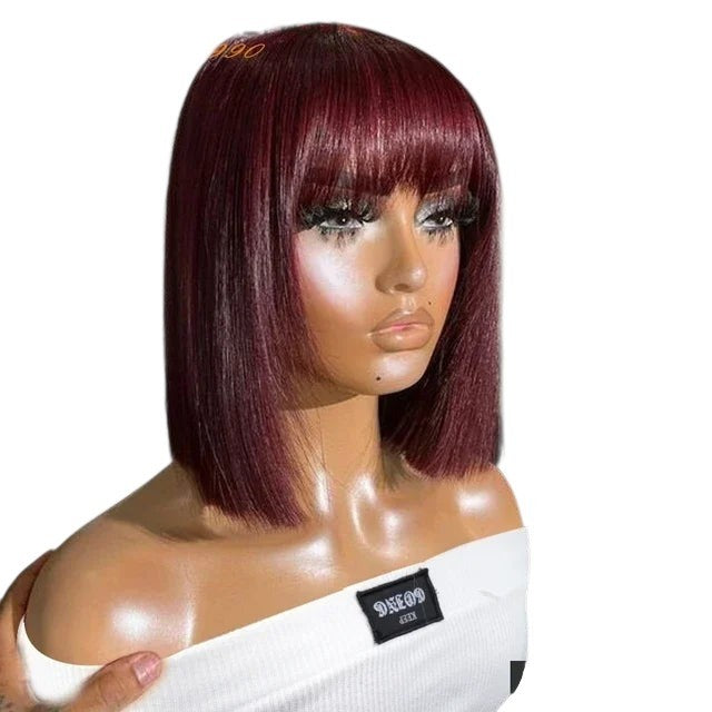 RitzWigs short straight bob wig in 99J burgundy red human hair with bangs on a mannequin