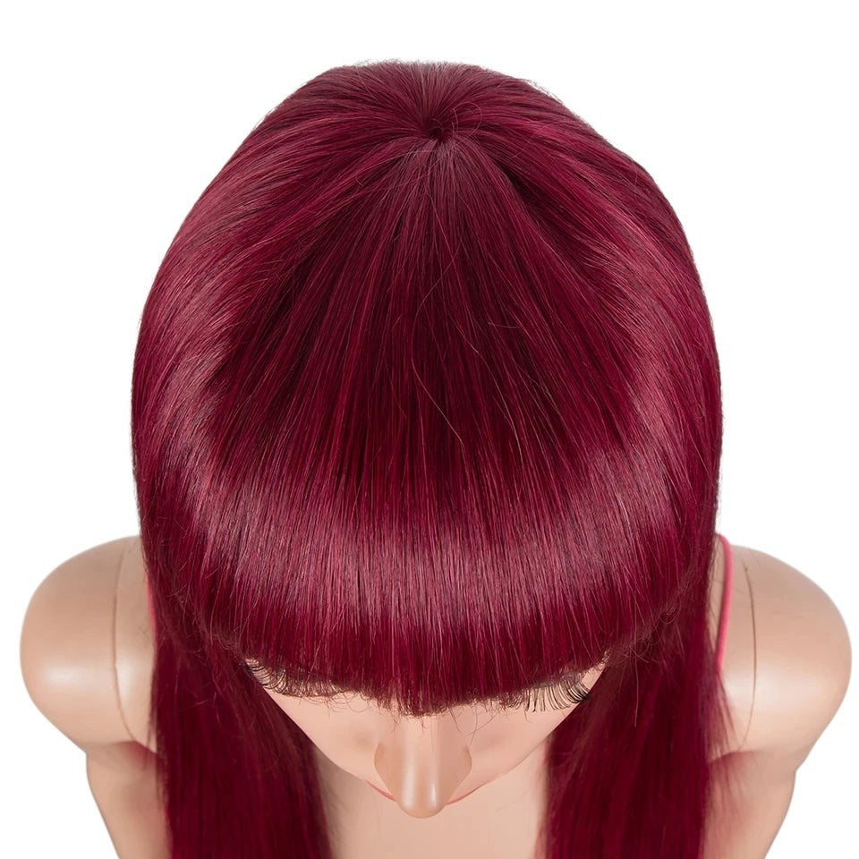 RitzWigs burgundy straight human hair wig with bangs on a mannequin head, top view showing sleek texture.