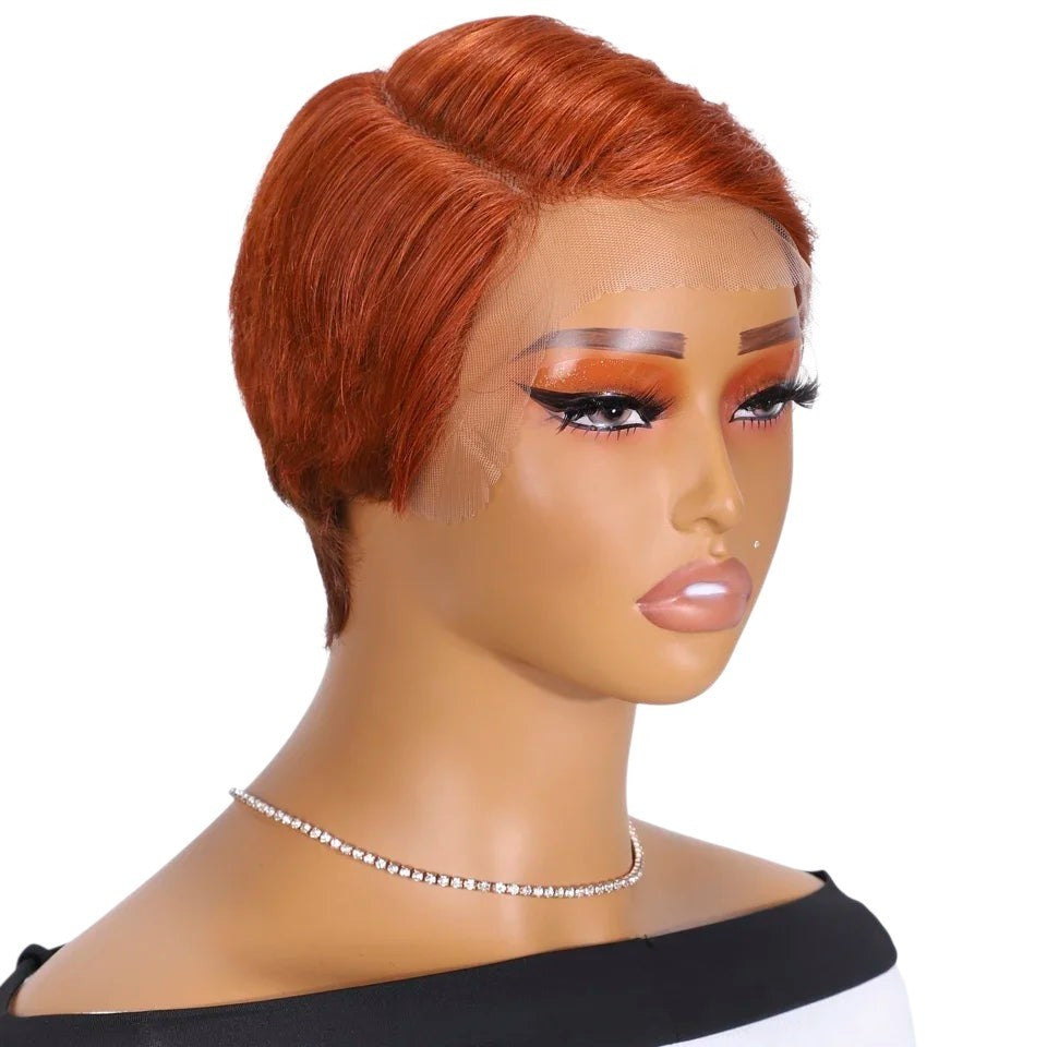 RitzWigs short copper orange pixie cut human hair wig with transparent lace front on a mannequin head