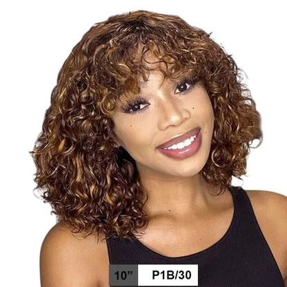 RitzWigs short curly bob human hair wig with bangs in P1B/30 highlight colour worn by a smiling woman