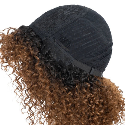 RitzWigs short kinky curly human hair wig showing the interior cap construction with adjustable straps and clips