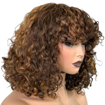 RitzWigs short kinky curly human hair wig with bangs and brown highlights on a mannequin head