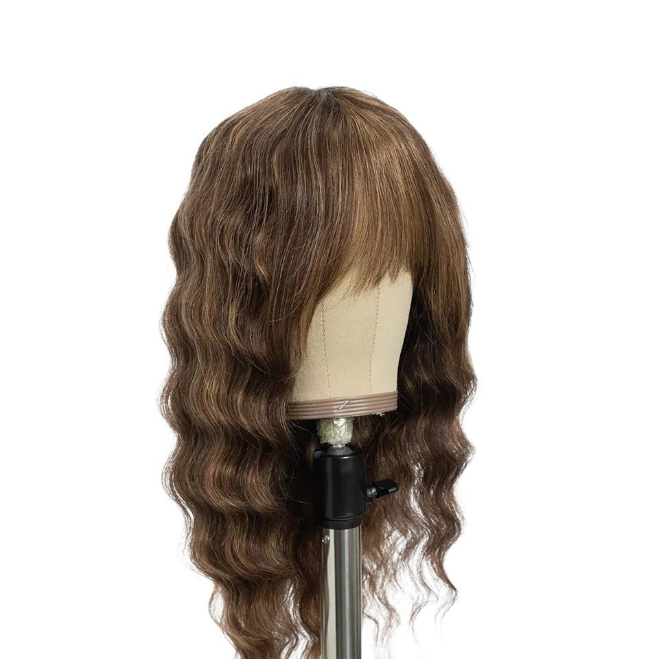 RitzWigs deep wave human hair wig with bangs in a natural brown shade on a mannequin head