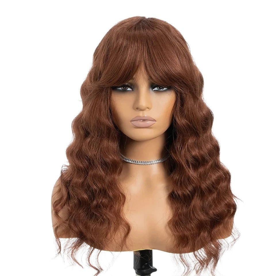 RitzWigs deep wave human hair wig in auburn brown with bangs on a mannequin head