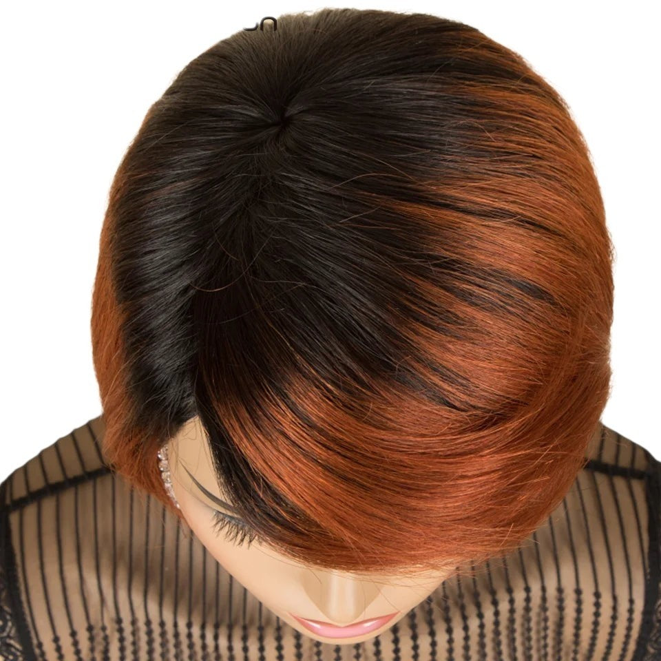 RitzWigs short straight pixie cut human hair wig in ginger and black ombre with a side part on a mannequin head