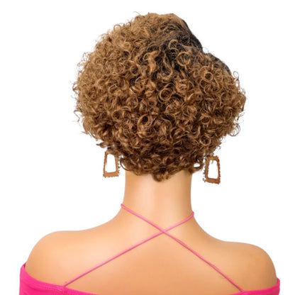 RitzWigs ginger curly short pixie cut human hair wig on a mannequin, back view showing textured deep wave curls.