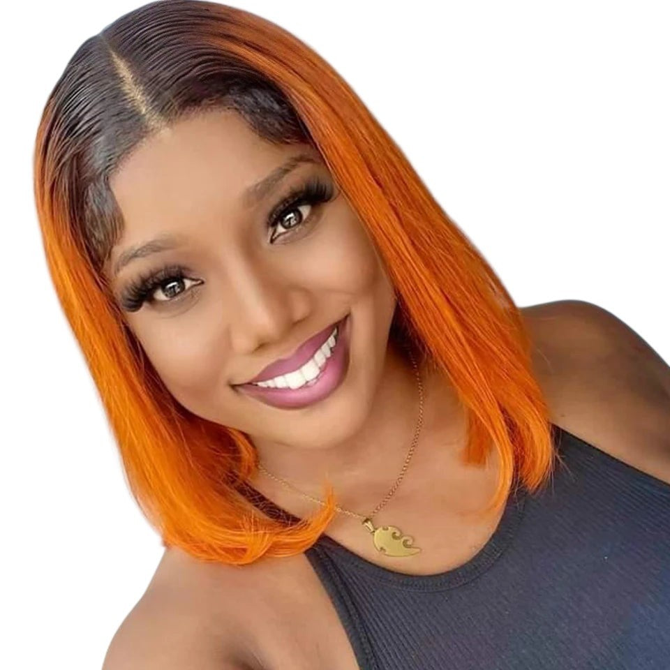 RitzWigs straight ginger ombre bob human hair wig with dark roots and transparent lace front on a smiling model