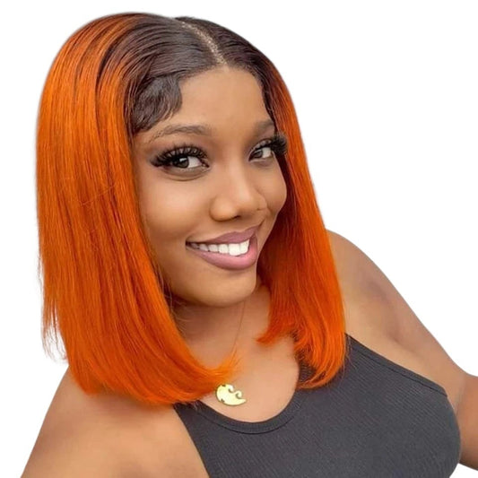 RitzWigs dark root ginger ombre straight bob human hair lace front wig worn by a smiling woman