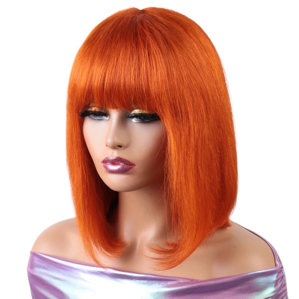 RitzWigs ginger orange straight short bob human hair wig with bangs worn by a mannequin