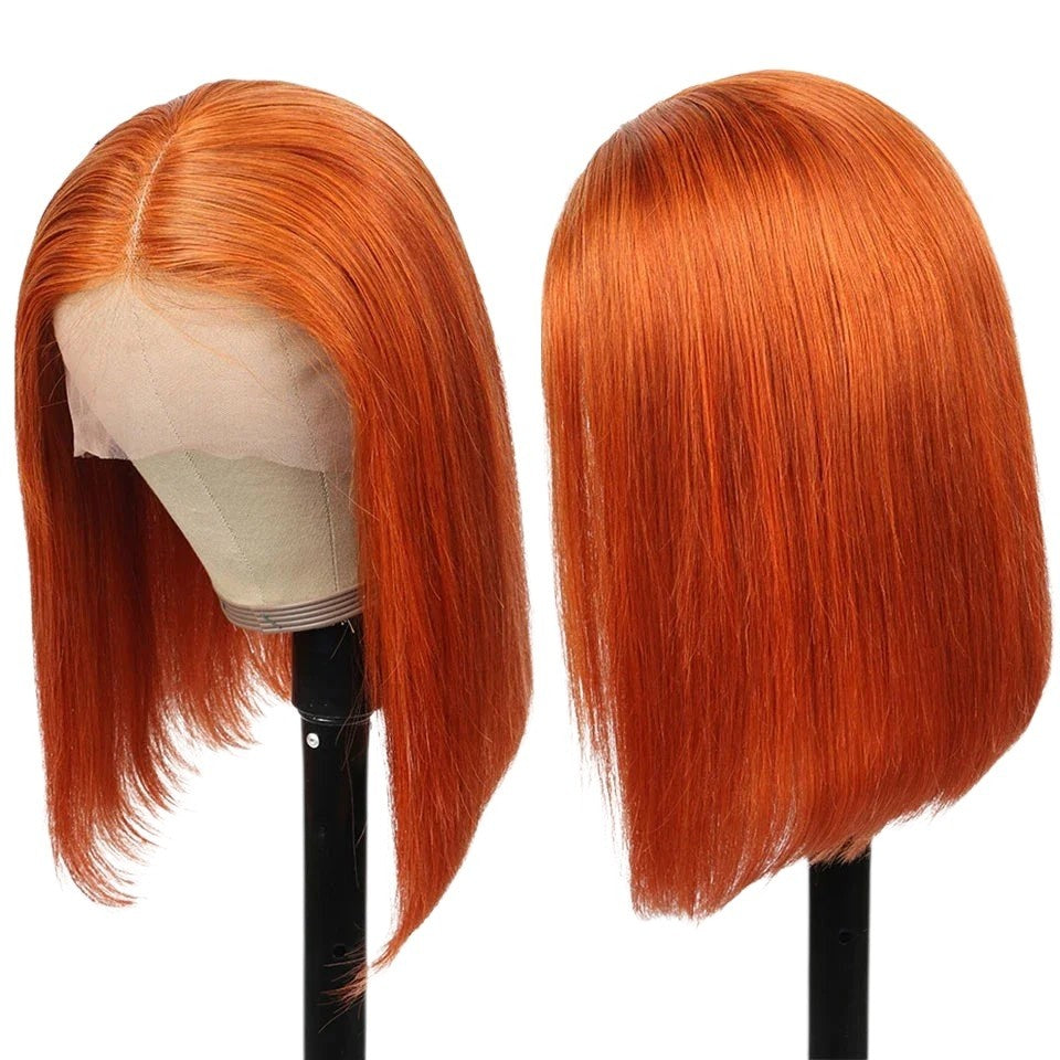 RitzWigs ginger orange straight bob human hair wig with transparent lace front and middle part on a mannequin head