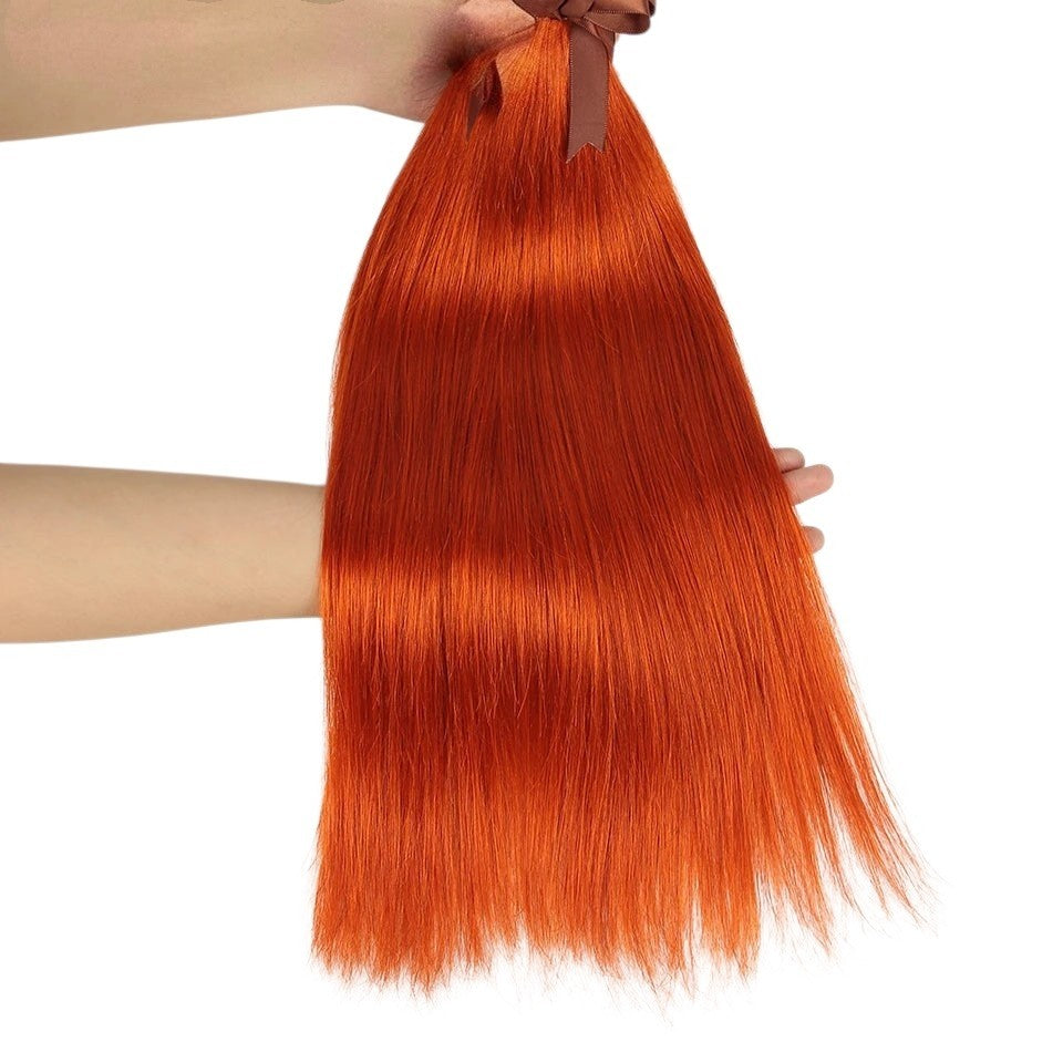RitzWigs ginger orange straight Brazilian human hair weave bundles held by hand