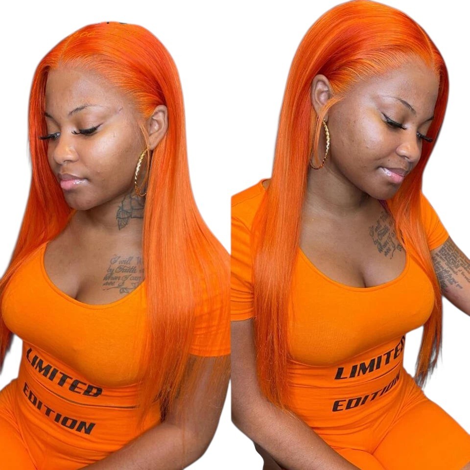 RitzWigs ginger orange straight Brazilian human hair extensions worn by a woman in a matching orange outfit