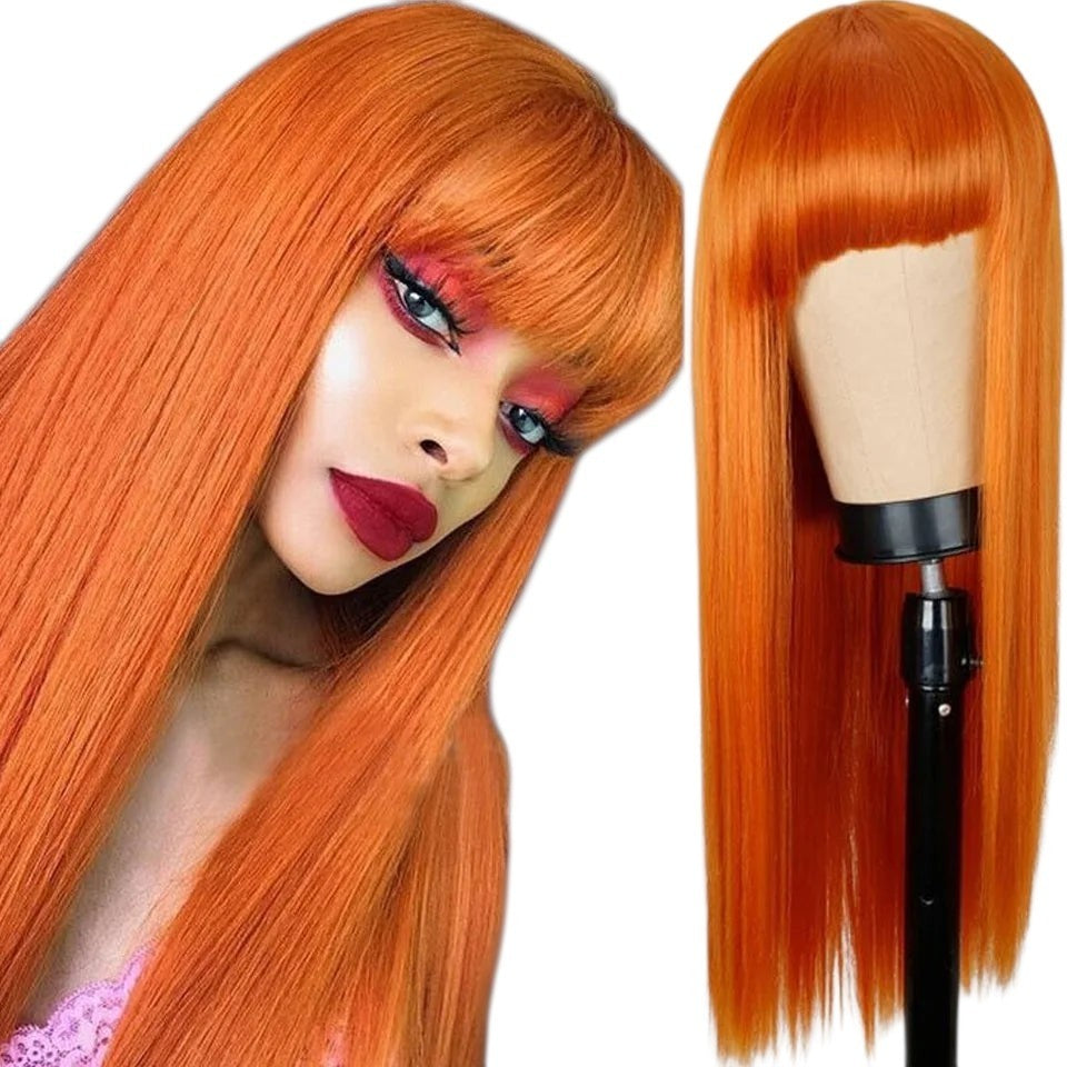 RitzWigs ginger orange long straight human hair wig with bangs worn by a model and displayed on a mannequin head