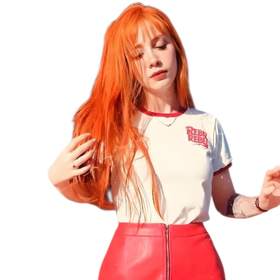 RitzWigs ginger long straight human hair wig worn by a woman in a white t-shirt and red skirt