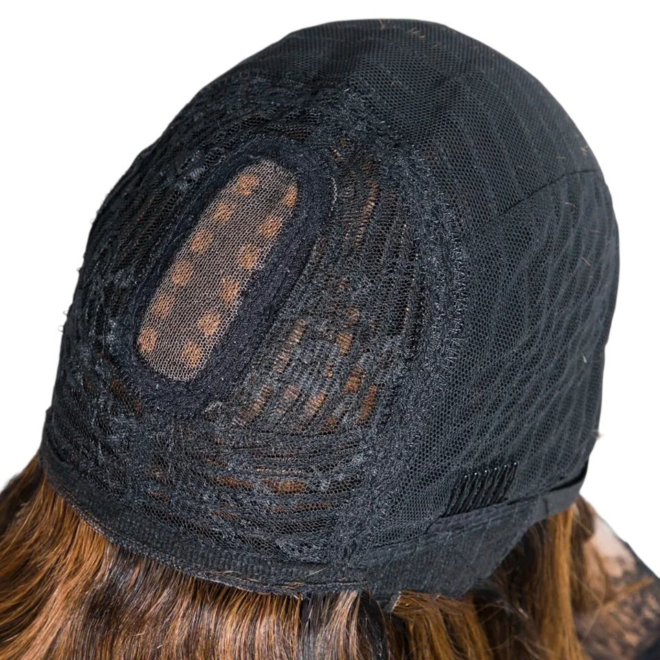 RitzWigs glueless human hair wig cap interior showing breathable black lace construction and adjustable straps