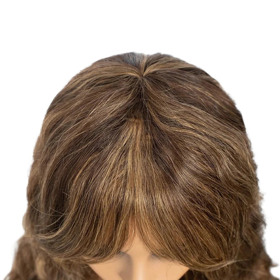 RitzWigs highlighted deep wave human hair wig with bangs, showing natural brown and blonde tones on a mannequin head.