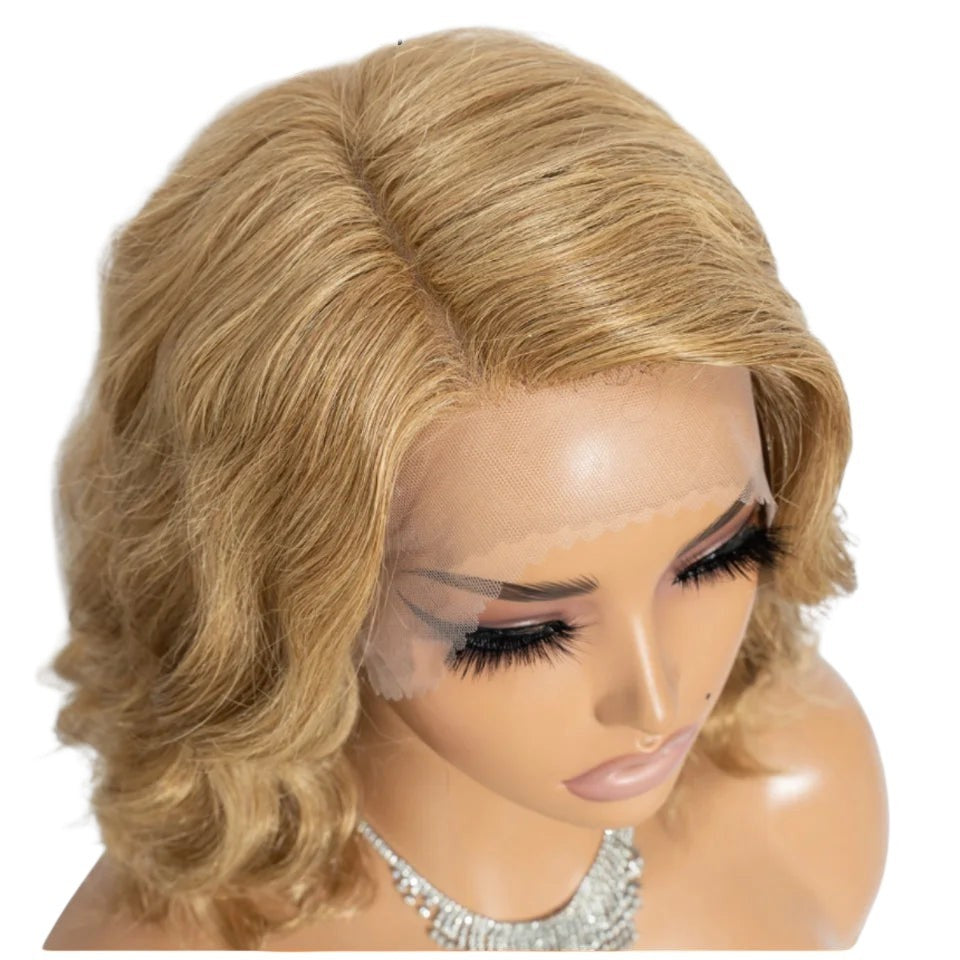 RitzWigs honey blonde body wave bob wig with transparent lace front on a mannequin head