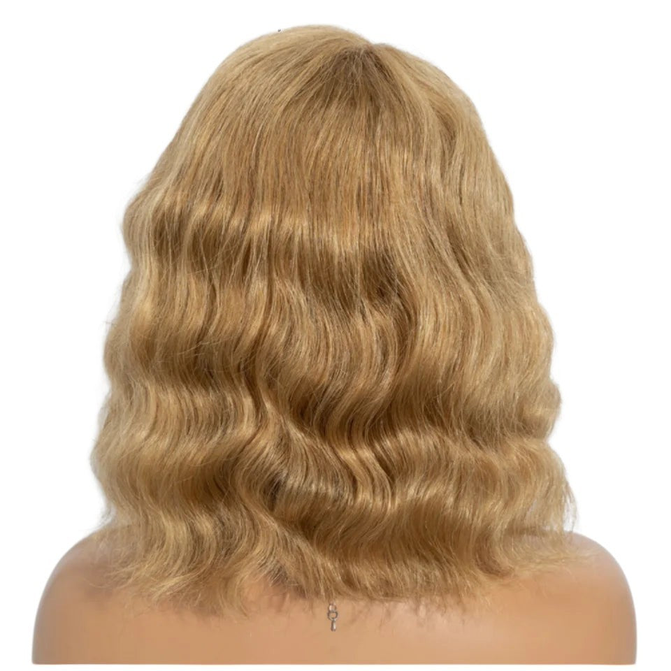 RitzWigs honey blonde body wave bob wig made of human hair on a mannequin head