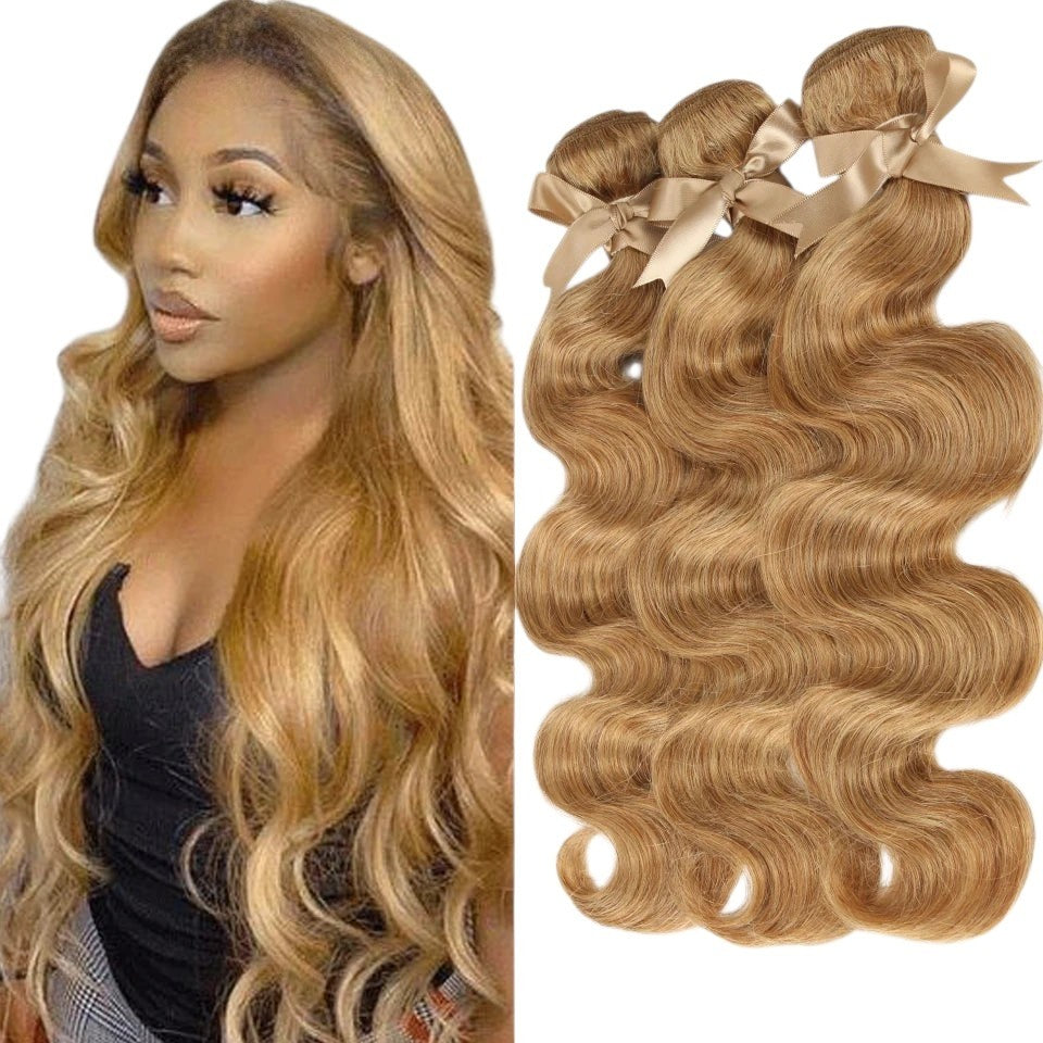 RitzWigs honey blonde Brazilian body wave Remy human hair bundles worn by a model with long wavy hair