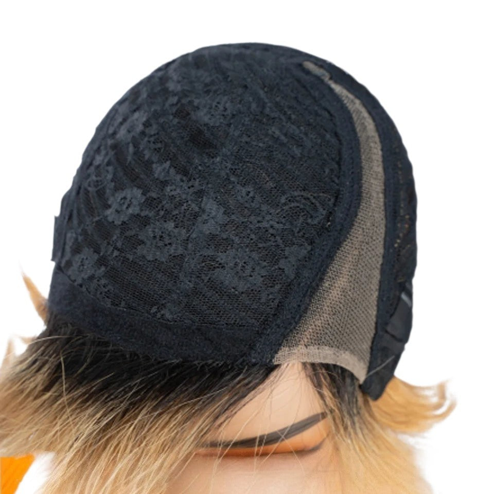 RitzWigs honey blonde pixie bob wig showing the interior black lace cap construction and light brown lace front