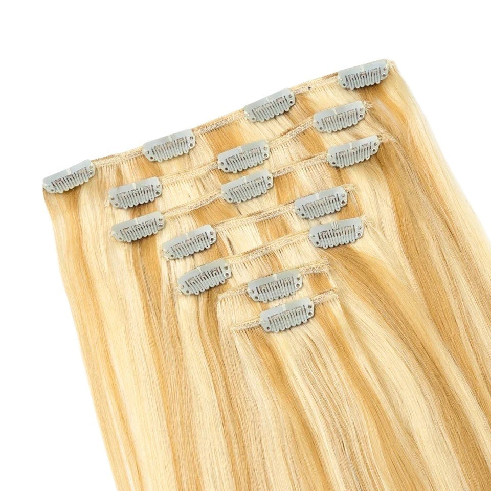 RitzWigs honey blonde straight human hair clip-in extensions with secure metal clips for easy application.