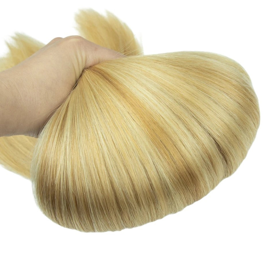RitzWigs honey blonde straight human hair weave bundle held in hand showing thick double drawn texture