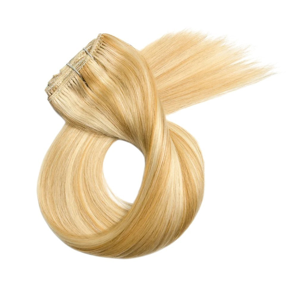 RitzWigs honey blonde straight human hair clip-in extensions in a 7-piece set with a smooth, silky texture.
